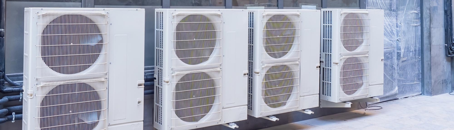 Side view of a row of outdoor HVAC units