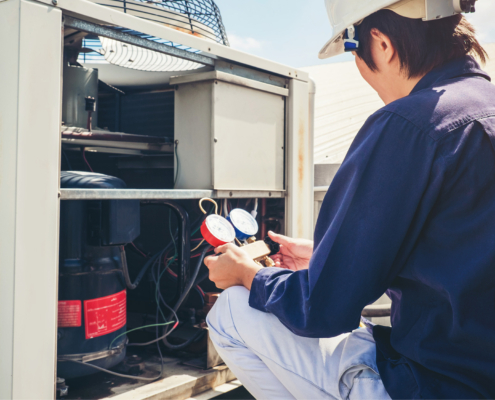 Technician is checking air conditioner