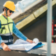 Worker looking over plans for HVAC upgrade