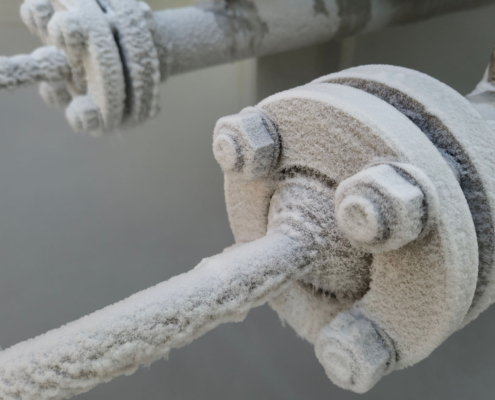 Close up view of frozen pipes for HVAC system