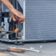 Close up of Air Conditioning Repair team use fuel gases and oxygen to weld or cut metals