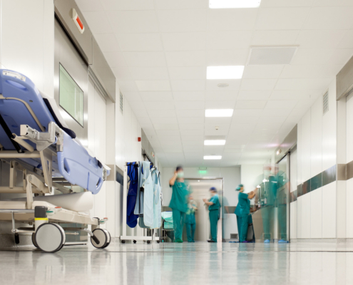 Workers in hospital corridor
